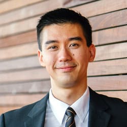 Smiling client testimonial portrait, man in a suit