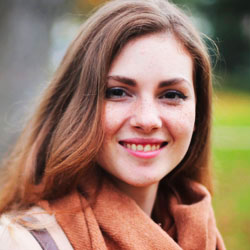 Smiling client testimonial portrait, woman wearing a scarf